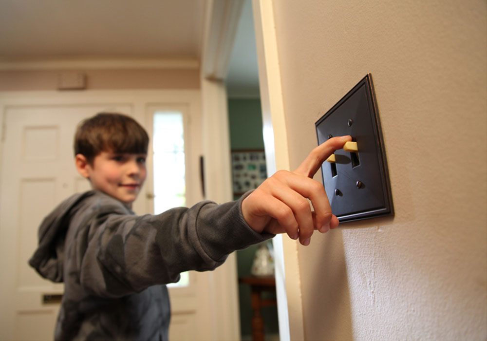 flipping-light-switch Boy flipping light switch